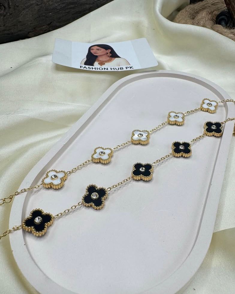 Floral Charm Bracelet – Black & White Enamel Elegance | FashionHubPK7